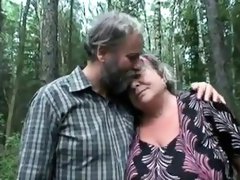 Chubby granny shares a cock with a naughty teen in the woods