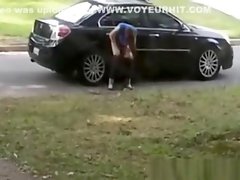 Totally drunk woman peeing on cars