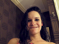 Brunette Eden Sin moans while getting fingered in the shower