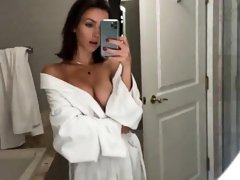 Mesmerizing young brunette sensually exposes her sexy body