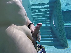 I jerk my very naughty big cock in a public spa pool and get caught